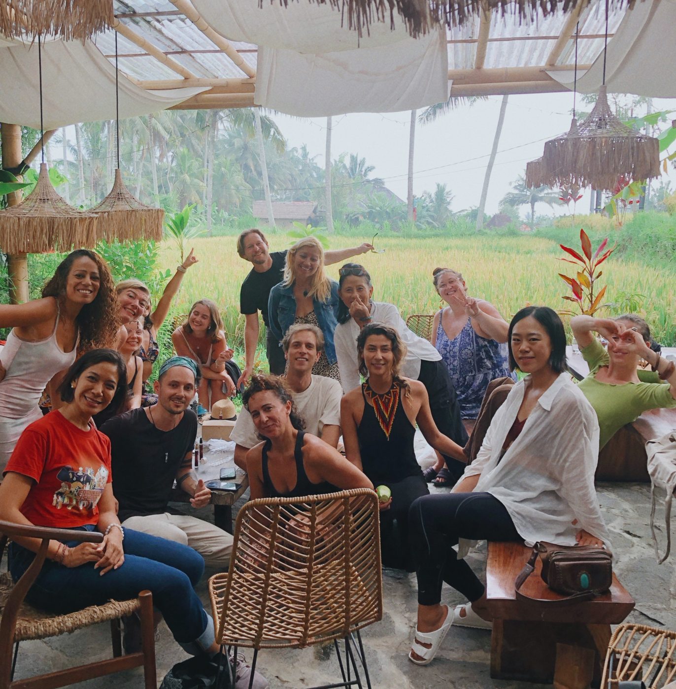 A smiling group gathered together outdoors