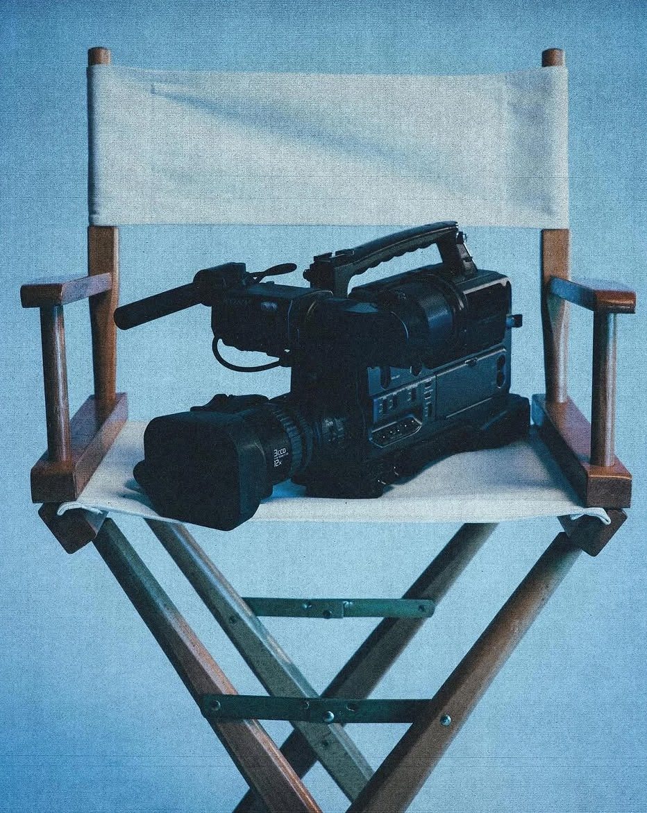 A video camera resting on a director's chair